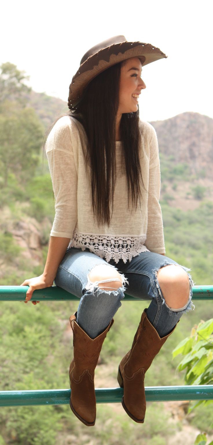 Hot Casual Cowgirl Outfit With Blue Ripped Denim And Brown Boots On Stylevore