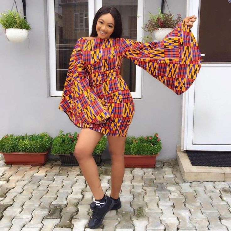 Ankara gowns with sneakers on Stylevore