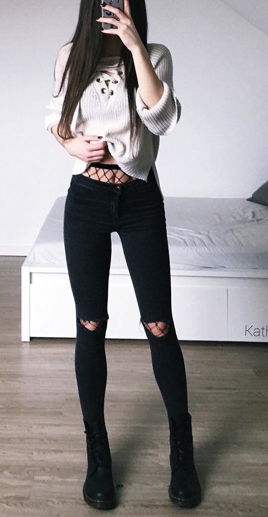 Black jeans with fishnets on Stylevore