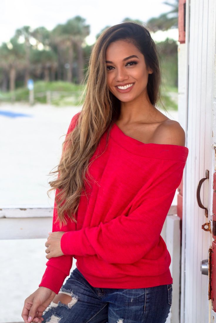 Red off the shoulder sweater on Stylevore